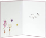 Floral birthday greeting card from the Into The Meadow range by UK Greetings, featuring colorful flower illustrations.