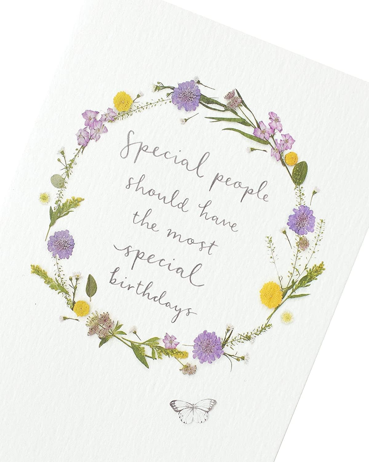 Colorful floral birthday greeting card from UK Greetings' Into The Meadow Range, featuring vibrant flower illustrations.