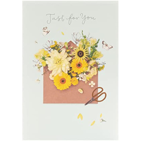 Colorful floral greeting card for birthdays by UK Greetings, featuring vibrant flower illustrations and cheerful design.