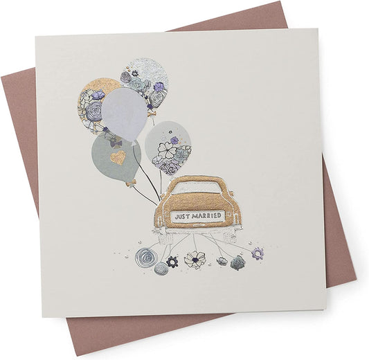 Wedding congratulations greeting card featuring a "Just Married" car design from UK Greetings, with colorful celebratory illustrations.