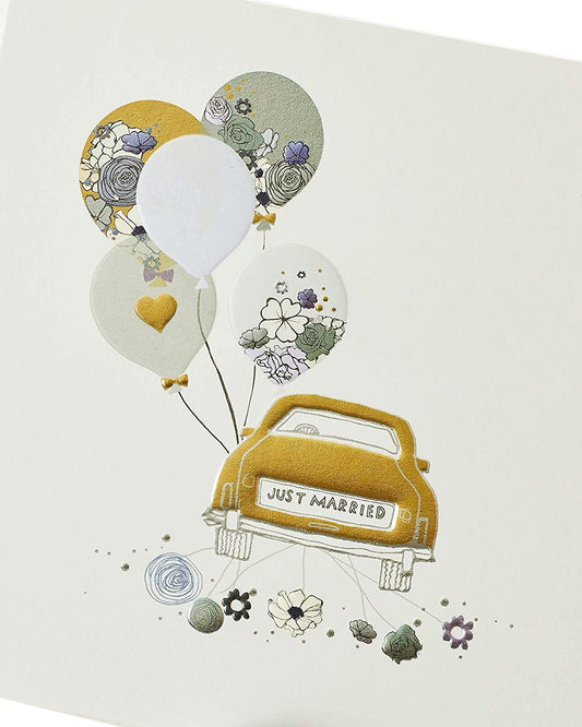 Wedding congratulations greeting card with "Just Married" car design from UK Greetings, featuring colorful wedding-themed artwork.