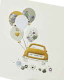 Wedding congratulations greeting card with "Just Married" car design from UK Greetings, featuring colorful wedding-themed artwork.