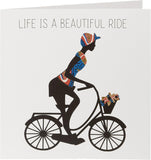 Kindred X Afrotouch greeting card titled "Life Is A Beautiful Ride" with colorful floral design and uplifting message.