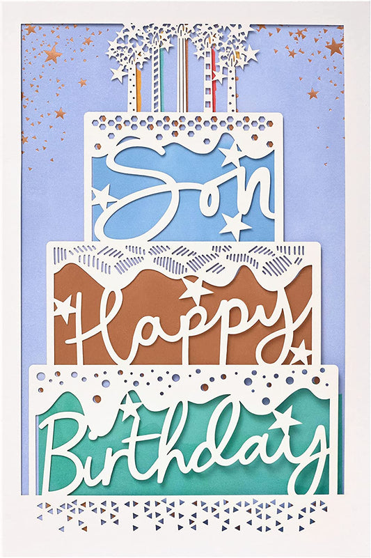 Laser-cut cake-shaped birthday greeting card from UK Greetings featuring intricate designs and vibrant colors.
