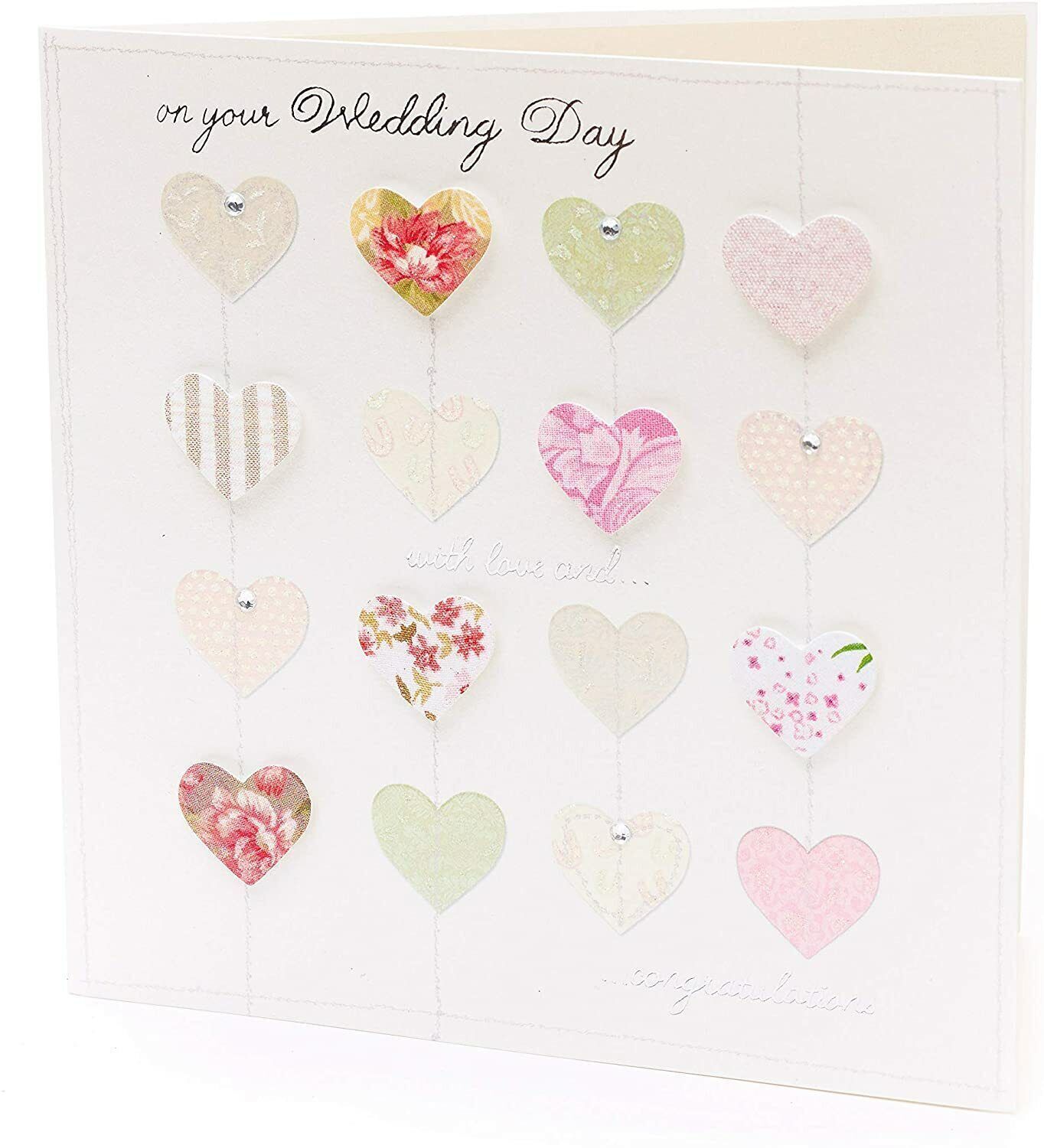 Luxury wedding greeting card by UK Greetings featuring 3D hearts and silver foil accents.