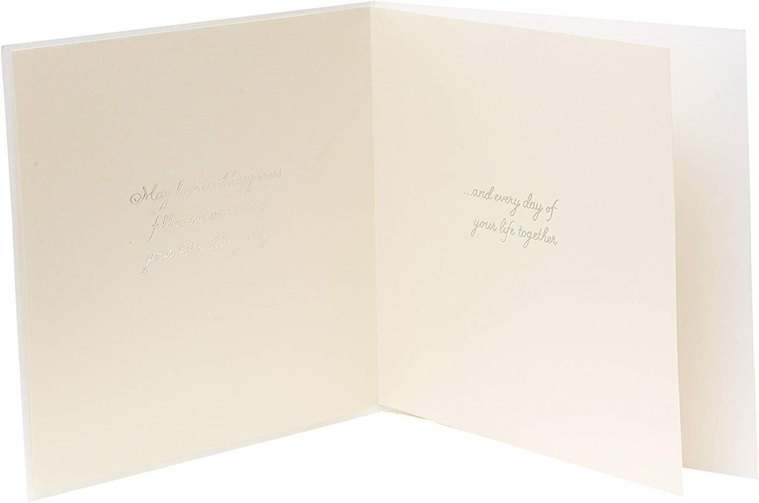 Luxury wedding greeting card with 3D hearts and silver foil accents, by UK Greetings, featuring elegant design and intricate details.