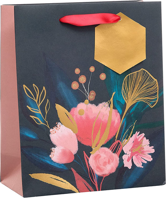 Medium floral gift bag with coordinating tag and greeting card from UK Greetings, featuring colorful floral design and decorative tag.