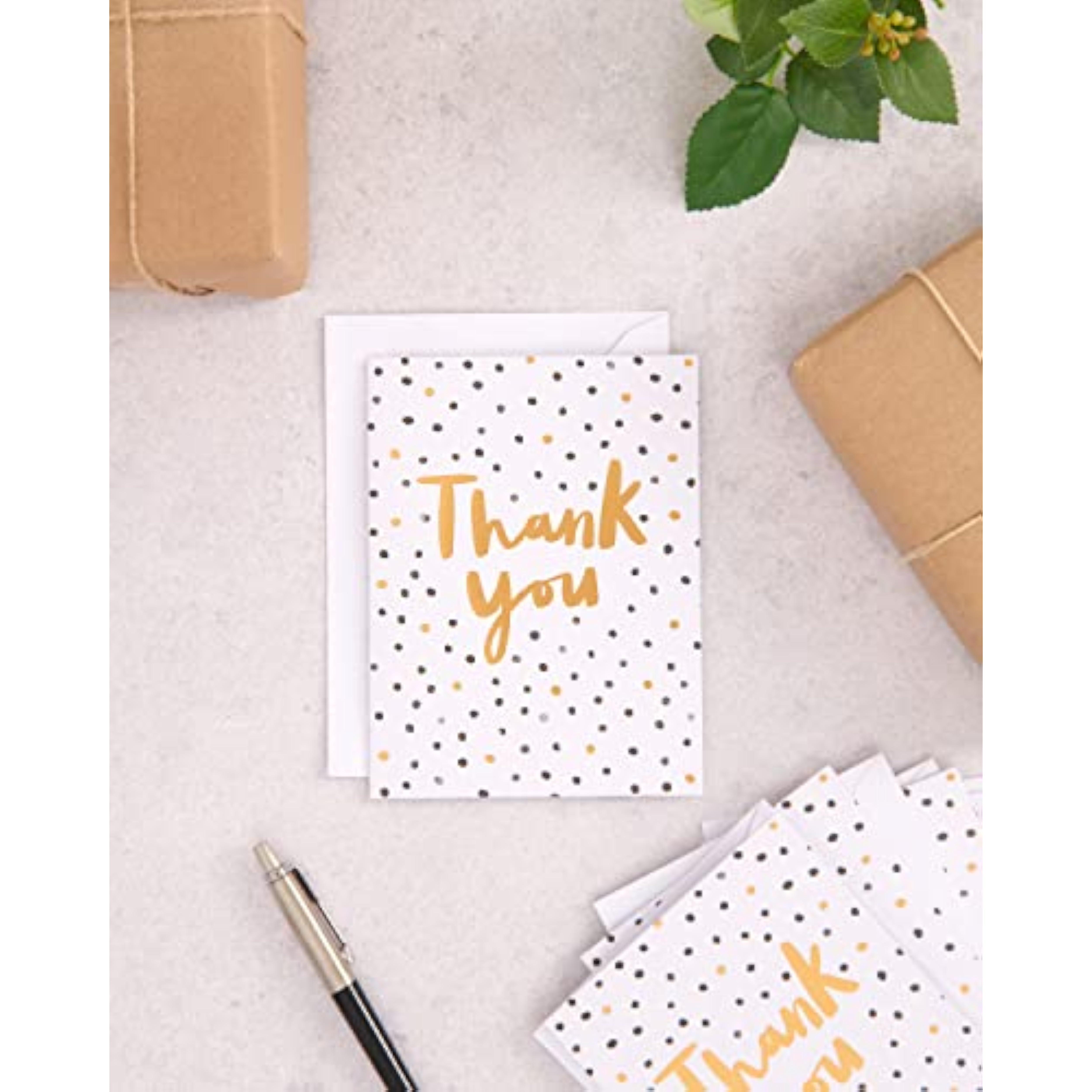 Set of 10 UK Greetings thank you greeting cards with black and gold spotty design, perfect for expressing gratitude.