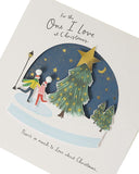 Romantic Christmas greeting card featuring a snow globe design, from UK Greetings, with festive holiday imagery and heartfelt message.
