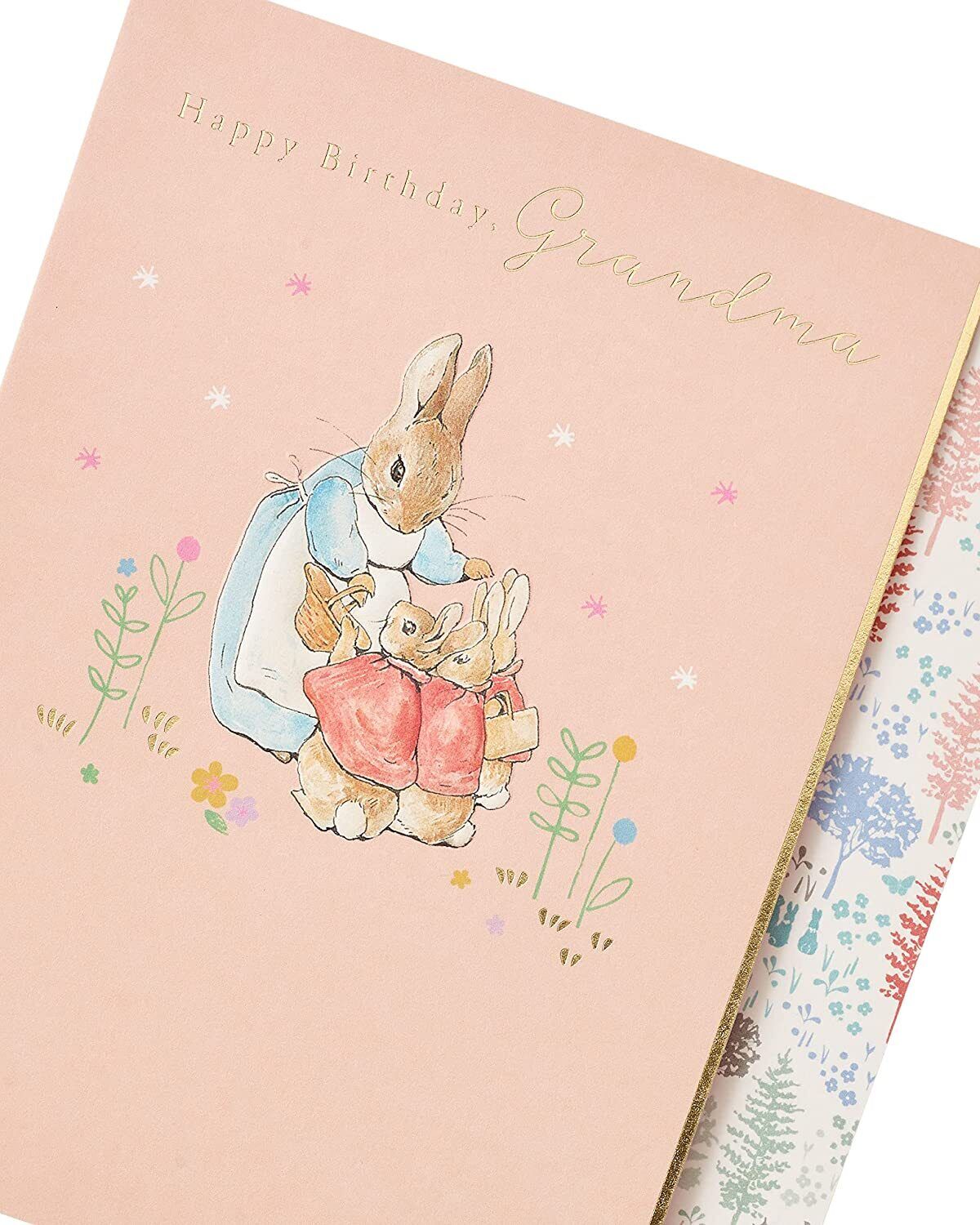 Peter Rabbit Grandma birthday greeting card by UK Greetings featuring a charming illustration of Peter Rabbit in a festive setting.