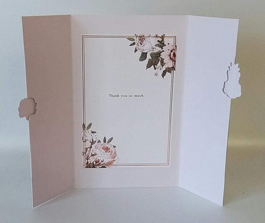 Elegant floral greeting card by UK Greetings with "Thank You" message, featuring colorful flower illustrations.