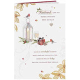 Robin, lantern, and foliage Christmas greeting card from UK Greetings featuring warm holiday love imagery.