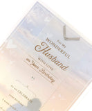 Romantic husband birthday greeting card with lovely words and a gem, designed by UK Greetings, featuring heartfelt message and decorative details.