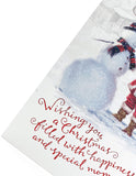 Festive Christmas greeting card featuring Santa and snowman with red foil and glitter accents, by UK Greetings.
