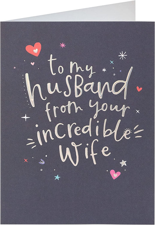 Silver holographic husband birthday greeting card with festive design from UK Greetings, featuring shiny, reflective surface and celebratory graphics.