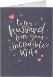 Silver holographic husband birthday greeting card with festive design from UK Greetings, featuring shiny, reflective surface and celebratory graphics.