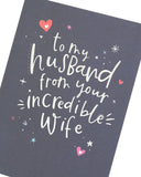 Silver holographic husband birthday greeting card with festive design, from UK Greetings, featuring shiny, eye-catching holographic details.