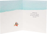 Festive Christmas greeting card featuring snow dogs crossing a snowy landscape, designed by UK Greetings for the holiday season.