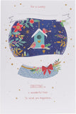 Snow globe greeting card featuring robins, designed for Christmas, by UK Greetings, with festive granddaughter illustration.