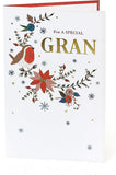 Hand-finished Christmas greeting card with floral embroidery design from UK Greetings, featuring festive holiday-themed artwork.