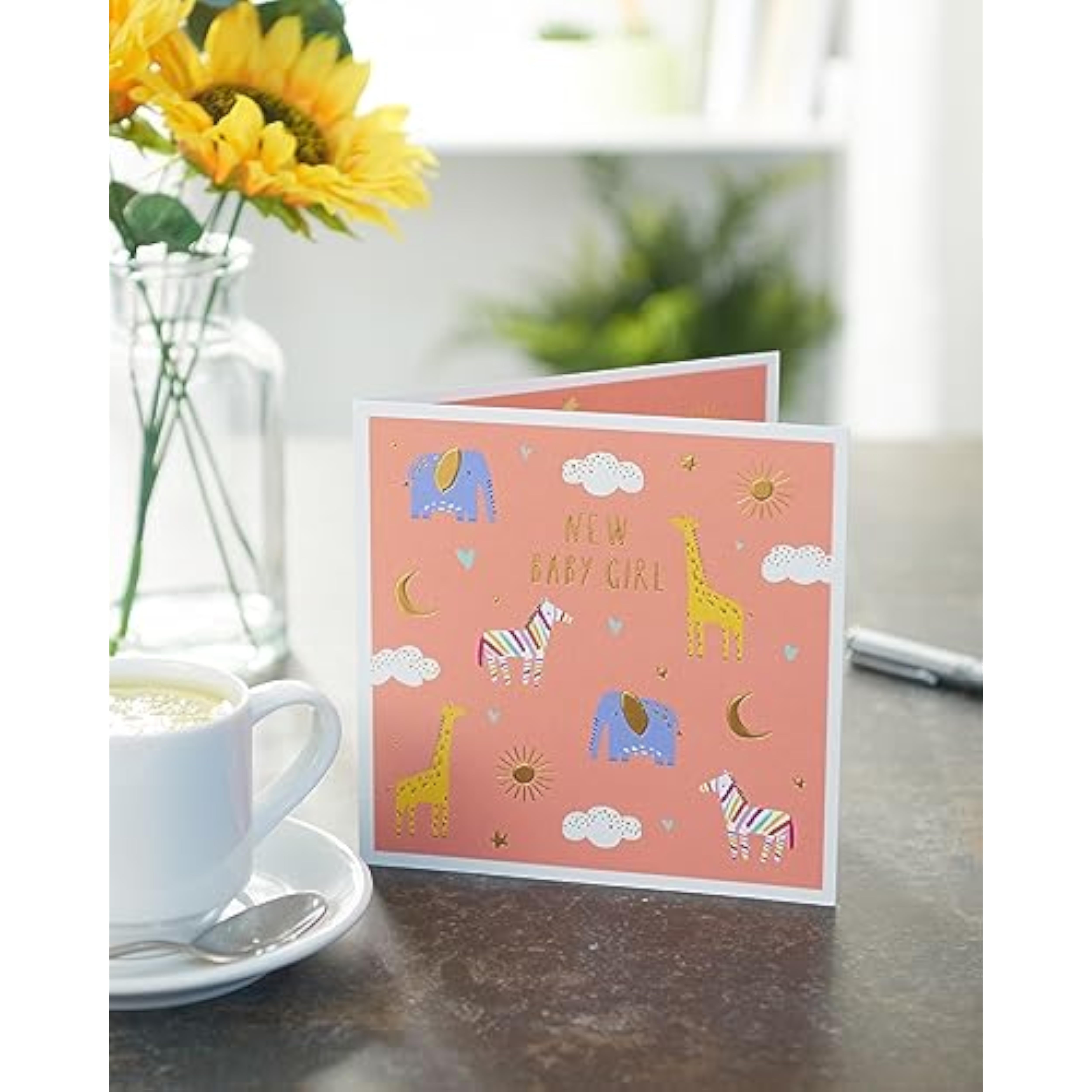 Sweet animal design greeting card for new baby girl, featuring adorable cartoon animals, by UK Greetings.