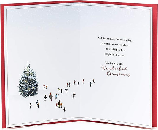 Winter ice-skating Christmas greeting card with festive holiday design from UK Greetings, featuring cheerful holiday scene.