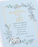 Traditional gold foil wedding greeting card with elegant design, featuring intricate patterns and a festive, celebratory appearance.