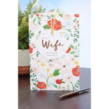 Bright floral design UK Greetings Valentine's Day greeting card for wife, featuring colorful flowers and heartfelt message.