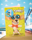 Colorful Wacky Big-Eyes Dog 7th Birthday greeting card by UK Greetings, featuring a playful dog illustration and festive design.