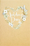 White wedding greeting card with elegant flower design, suitable for him, her, or a friend, by UK Greetings.