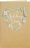 White wedding greeting card with elegant flower design for him, her, or friend by UK Greetings, featuring a delicate floral pattern.