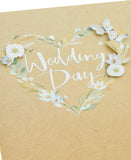 White flower design wedding greeting card for him, her, or friends by UK Greetings, featuring elegant floral artwork.