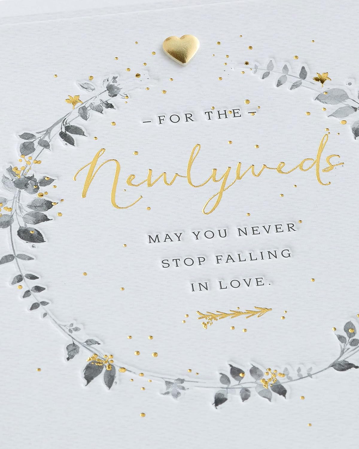 Wedding greeting card for him, her, or friend featuring a elegant wreath design from UK Greetings.