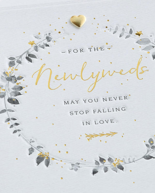 Wedding greeting card for him, her, or friend featuring a elegant wreath design from UK Greetings.