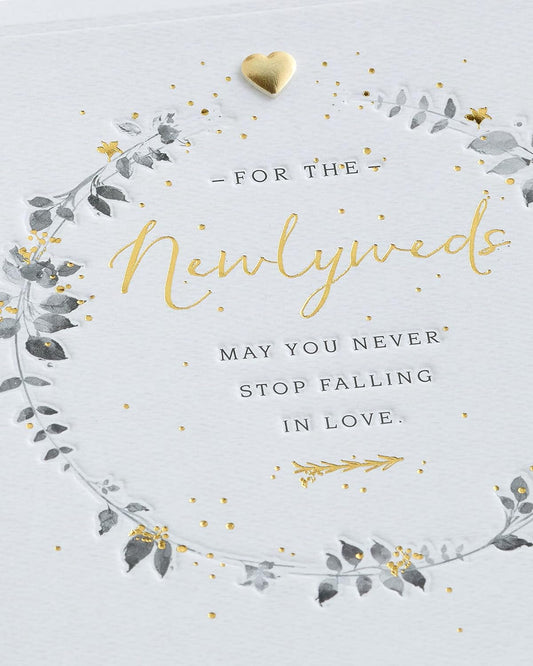 Wedding greeting card for him, her, or friend featuring a elegant wreath design from UK Greetings.