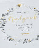 Wedding greeting card for him, her, or friend featuring a elegant wreath design from UK Greetings.