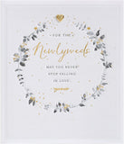 Wedding greeting card for him, her, or friend with a elegant wreath design by UK Greetings, featuring floral and heartfelt details.