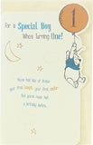 Winnie the Pooh first birthday boy greeting card with colorful illustrations and cheerful design, perfect for celebrating a special day.