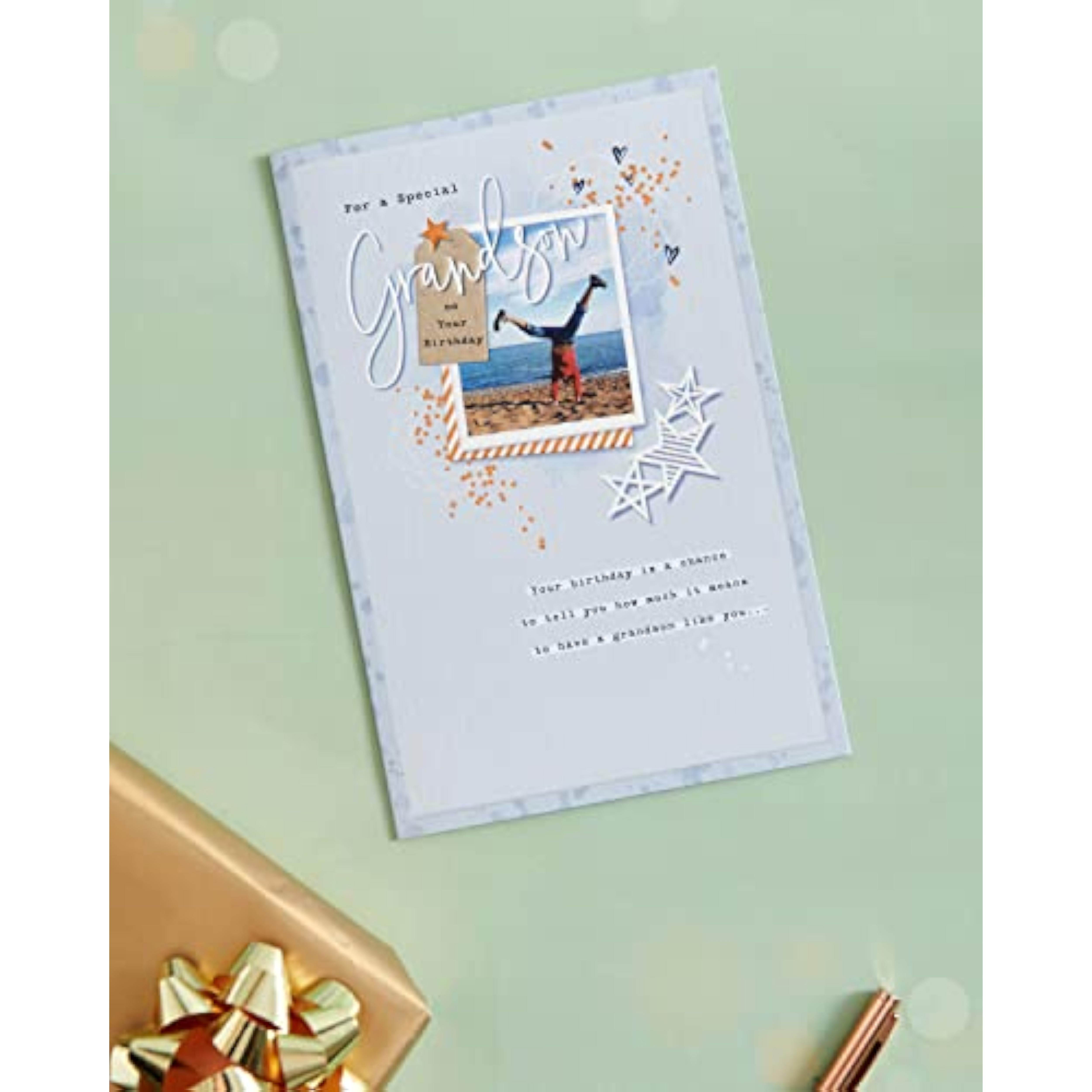 Greeting card for grandson with heartfelt copper foil design, featuring a colorful birthday message on the front.
