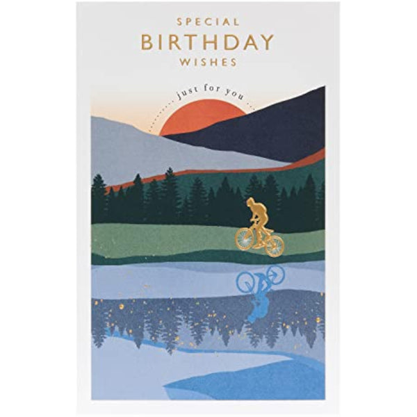 UKG birthday greeting card for him featuring a cyclist and sunset with gold foil design, suitable for celebrating special occasions.