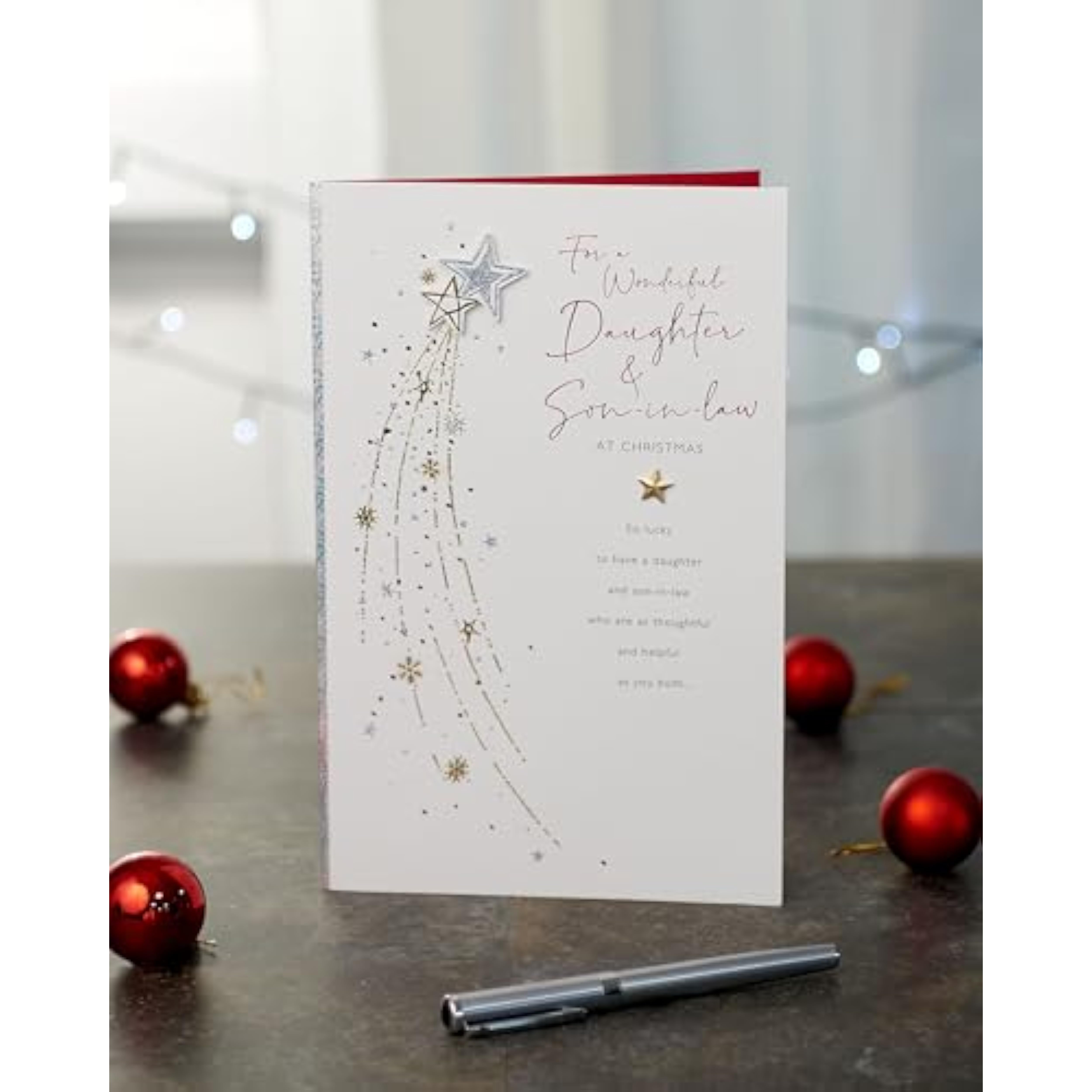 UKG Christmas greeting card for daughter and son-in-law featuring a shooting star foil design on a festive background.