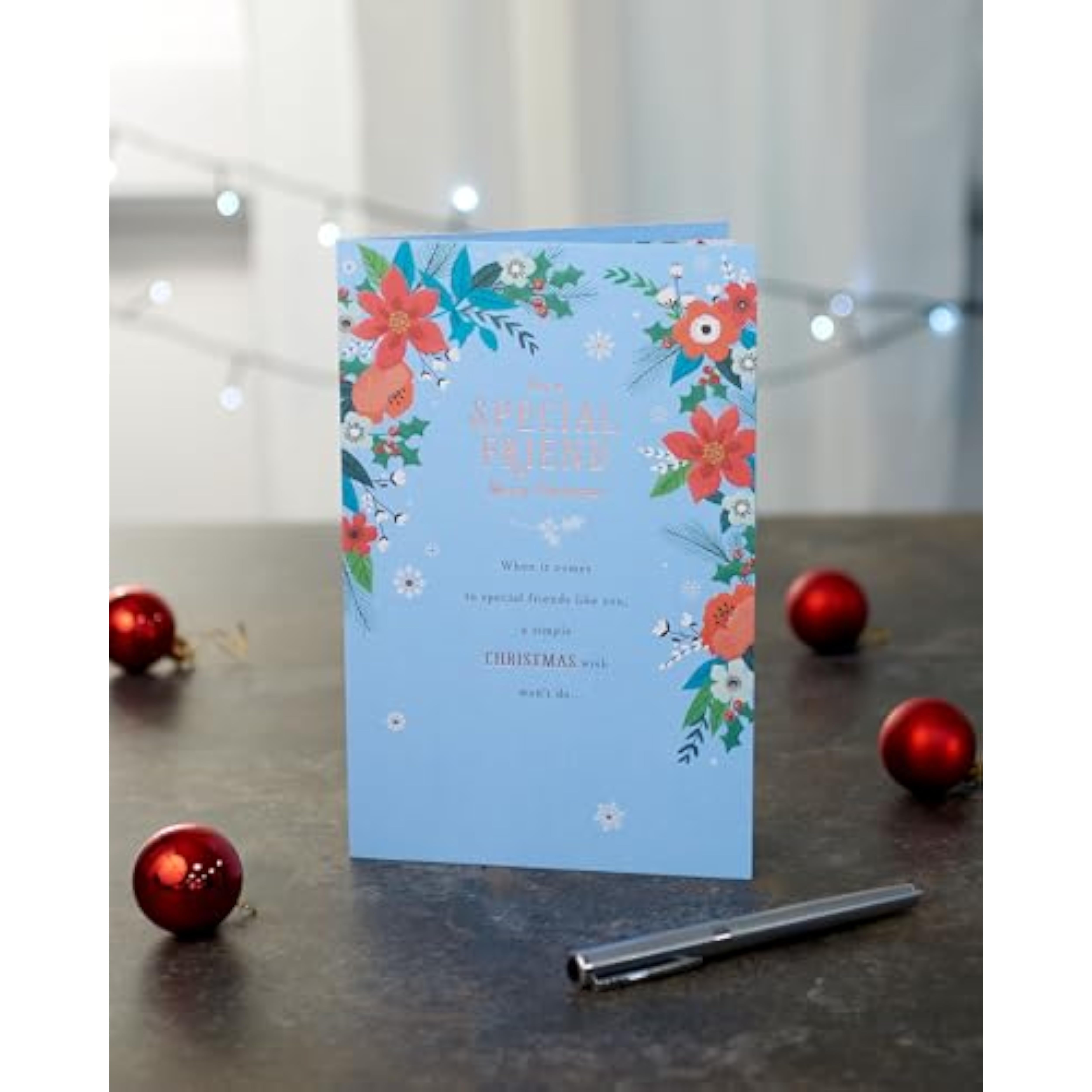Elegant Christmas greeting card for friends by UKG featuring a floral design with copper foil accents.