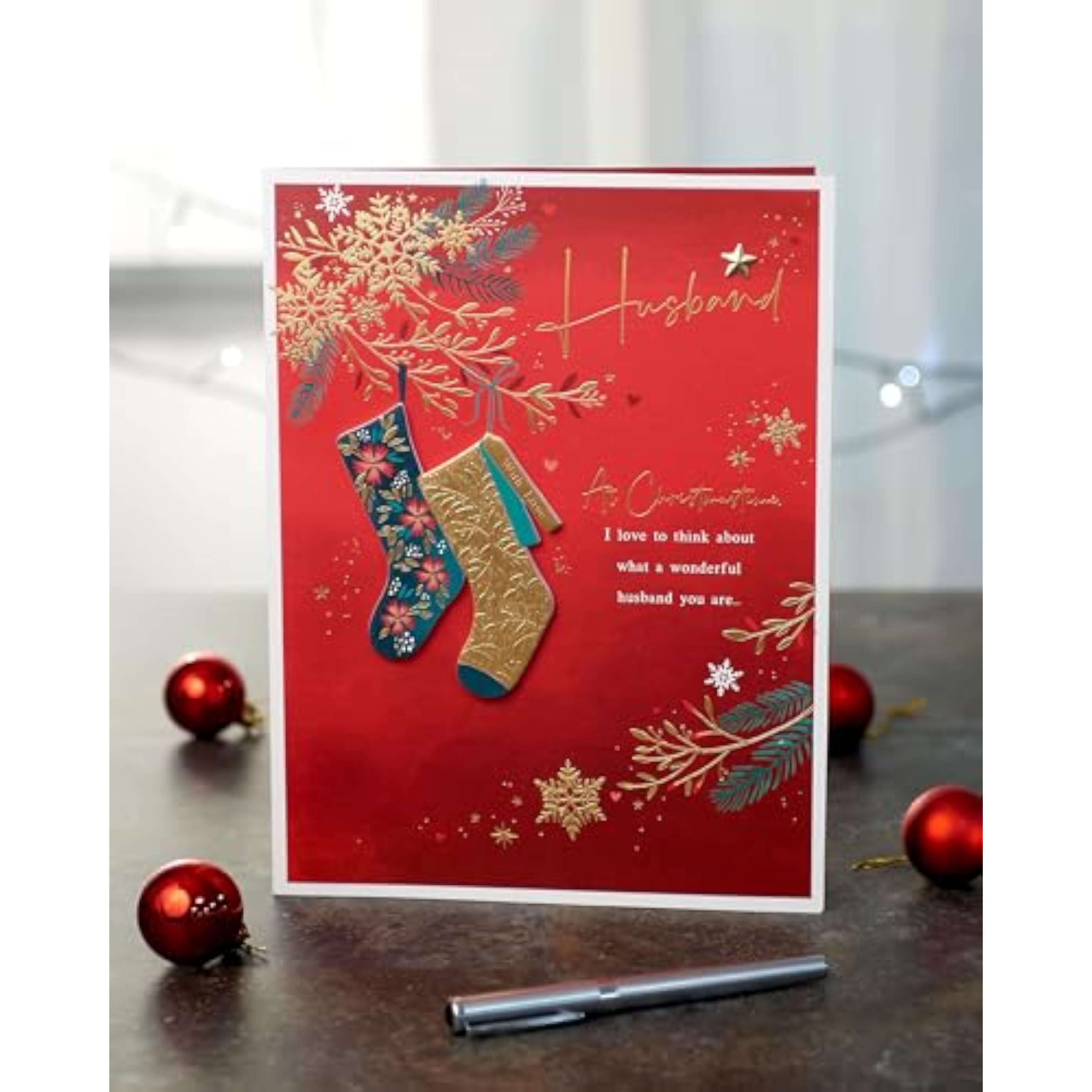 Deep red and gold Christmas greeting card for husband featuring stockings design, by UKG.