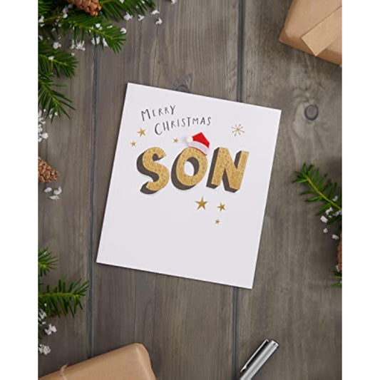 Christmas greeting card for son featuring gold lettering and a felt Santa hat from UKG, with festive holiday design and cheerful details.