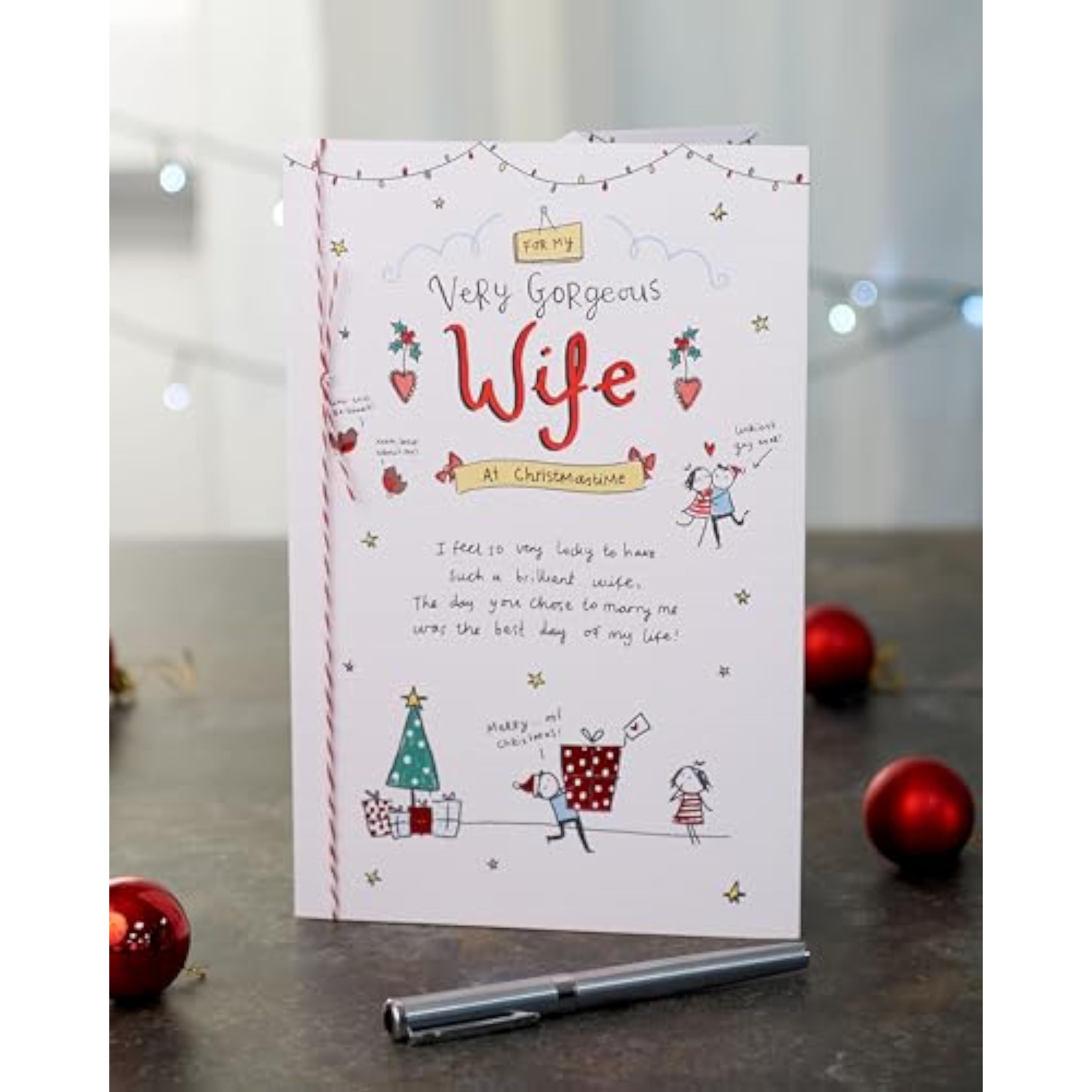 UKG Christmas greeting card for wife featuring sketch design, rhyming verse, and red foil accents.