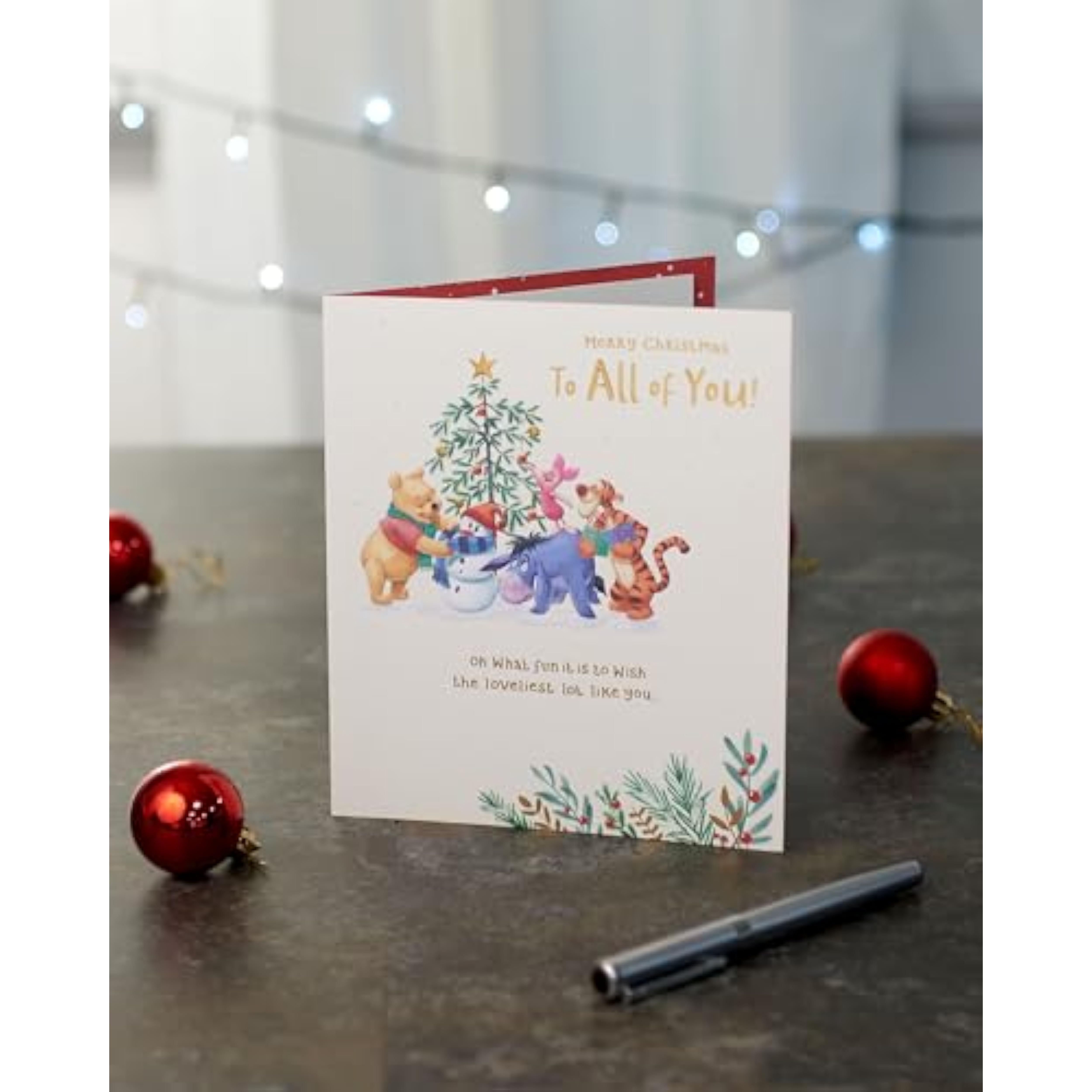 Disney Winnie the Pooh Christmas greeting card featuring Pooh and friends with a festive foil design, perfect for holiday wishes.