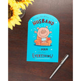 Humorous husband birthday greeting card from UKG with funny design, featuring colorful illustrations and playful text.