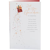 UKG Grandson Christmas greeting card featuring snowflakes and a festive present design on a cheerful holiday background