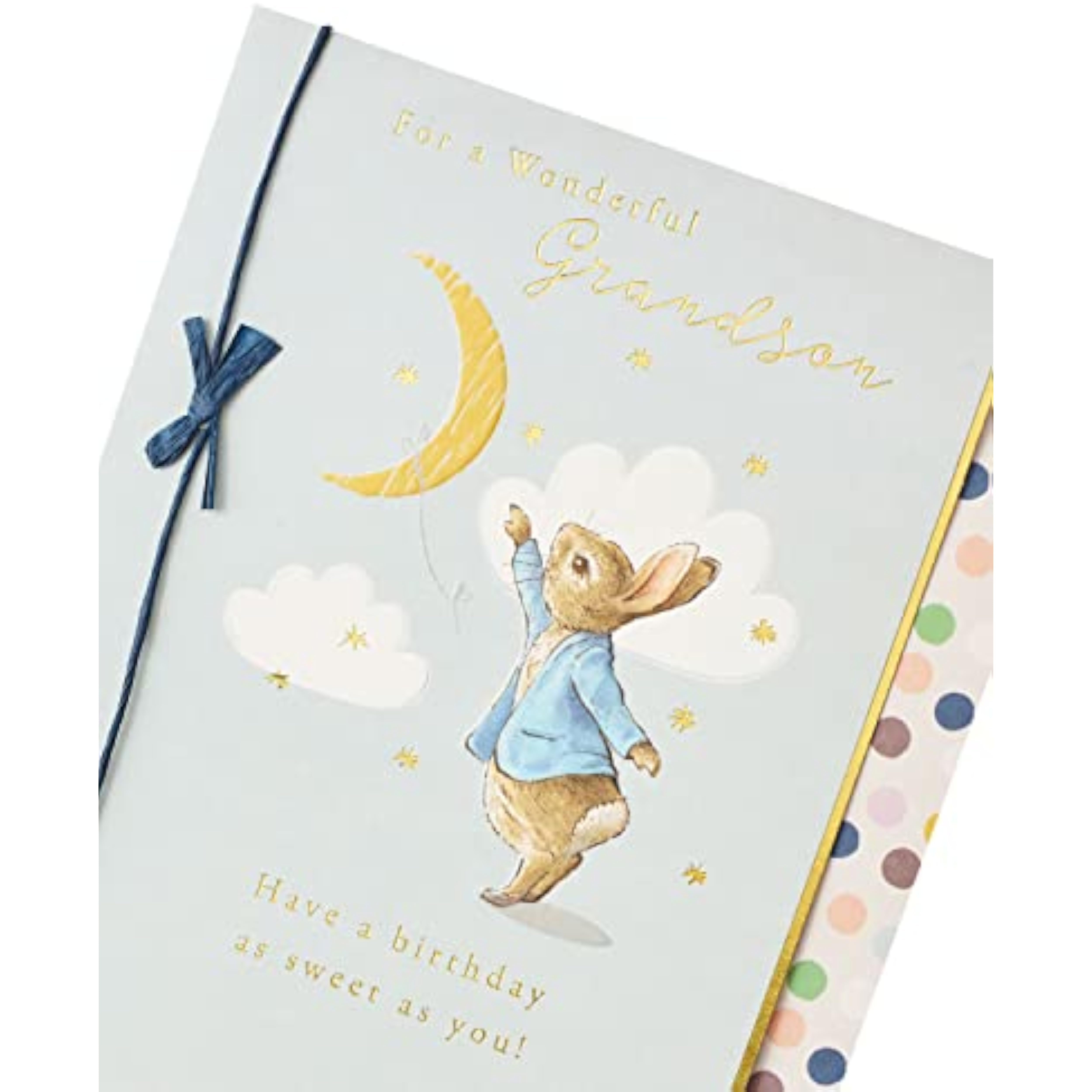 Peter Rabbit birthday greeting card for grandson with blue bow, featuring a charming illustration and UKG branding.