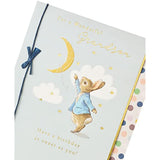 Peter Rabbit birthday greeting card for grandson with blue bow, featuring a charming illustration and UKG branding.